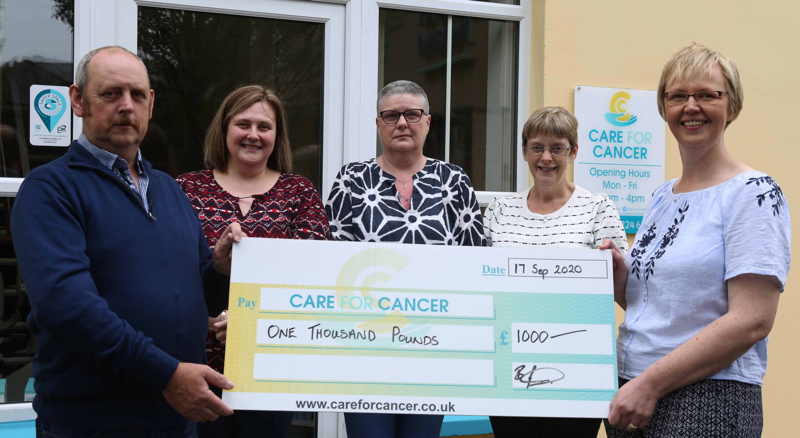 Family of late Omagh woman present £1,000 to charity