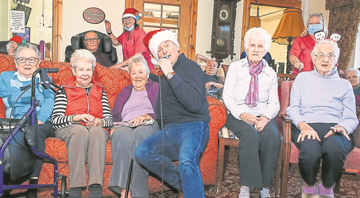 Singer Cuddy brings some festive cheer to care home