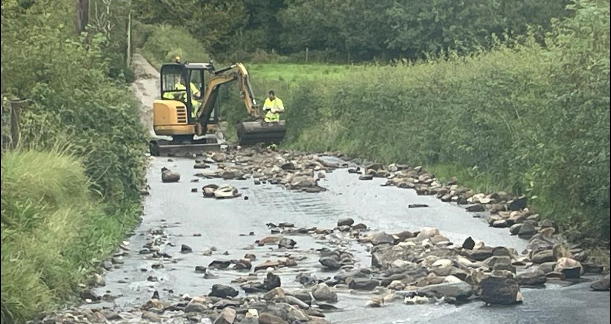 Rural roads blocked by hillside boulders