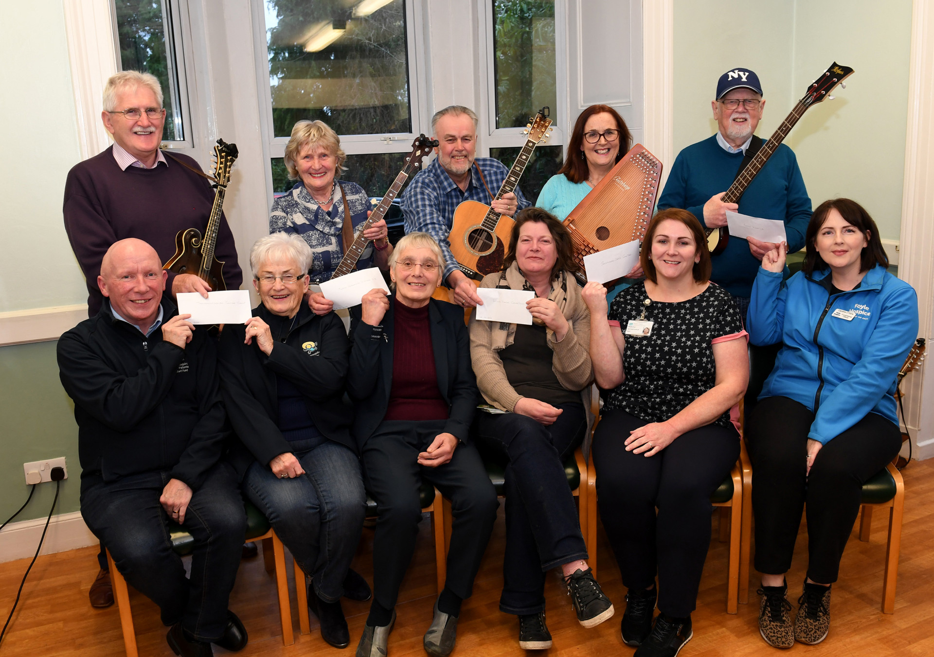 £1,000 cheques from band are music to the ears of local charities