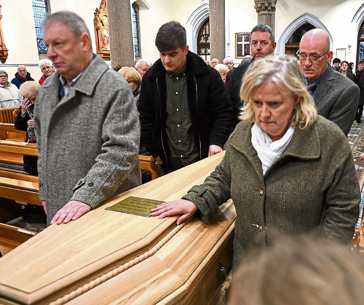 People gather at Omagh church to honour Father Eugene Hasson