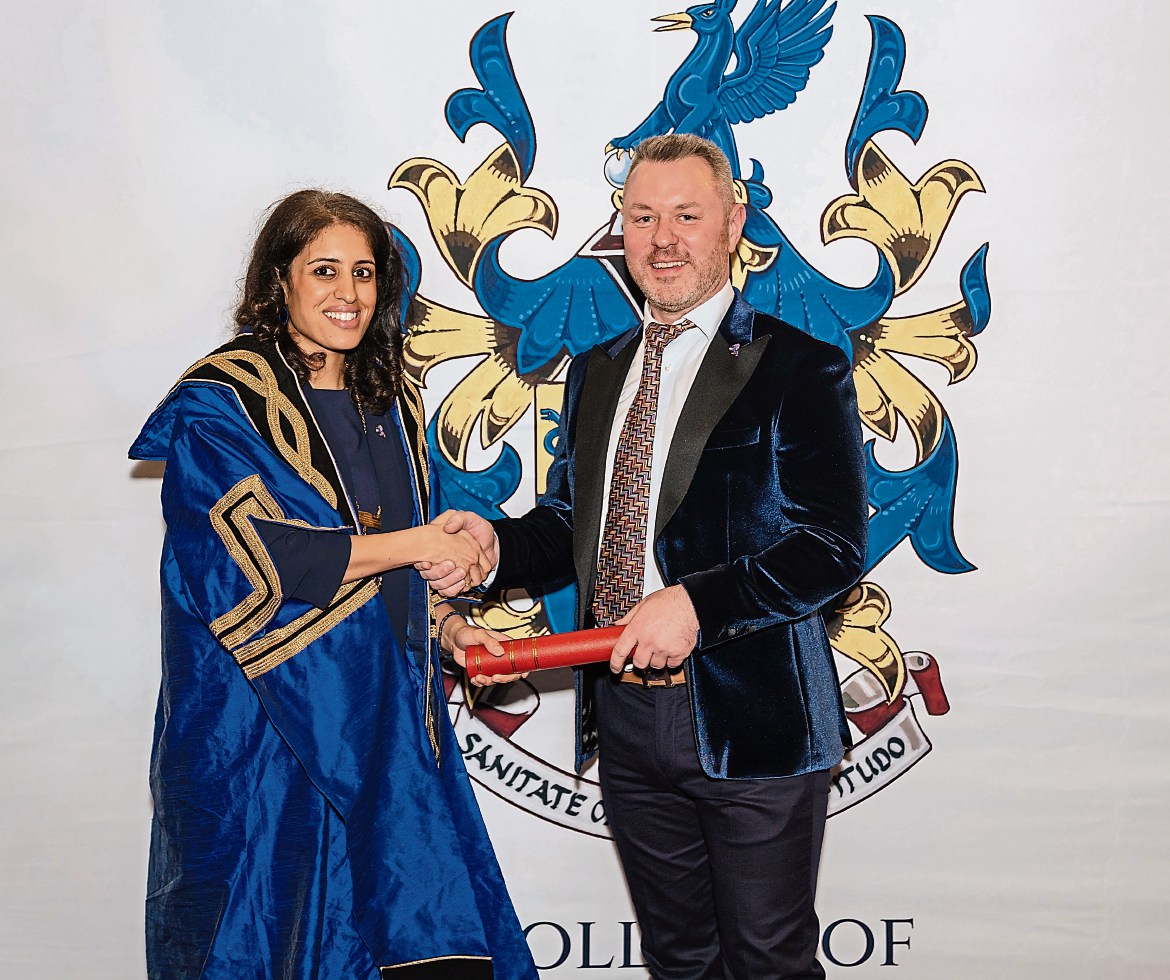 Omagh dentist honoured with prestigious award on his birthday