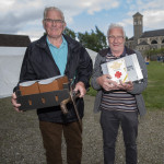 Friends James Hamilton and Colin Campbell happy with their day; a bellyful of strawberries and some second hand market bargains. JasMc11
