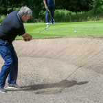 Paul McSwiggan plays his ball from the 18th bunker.JMG12