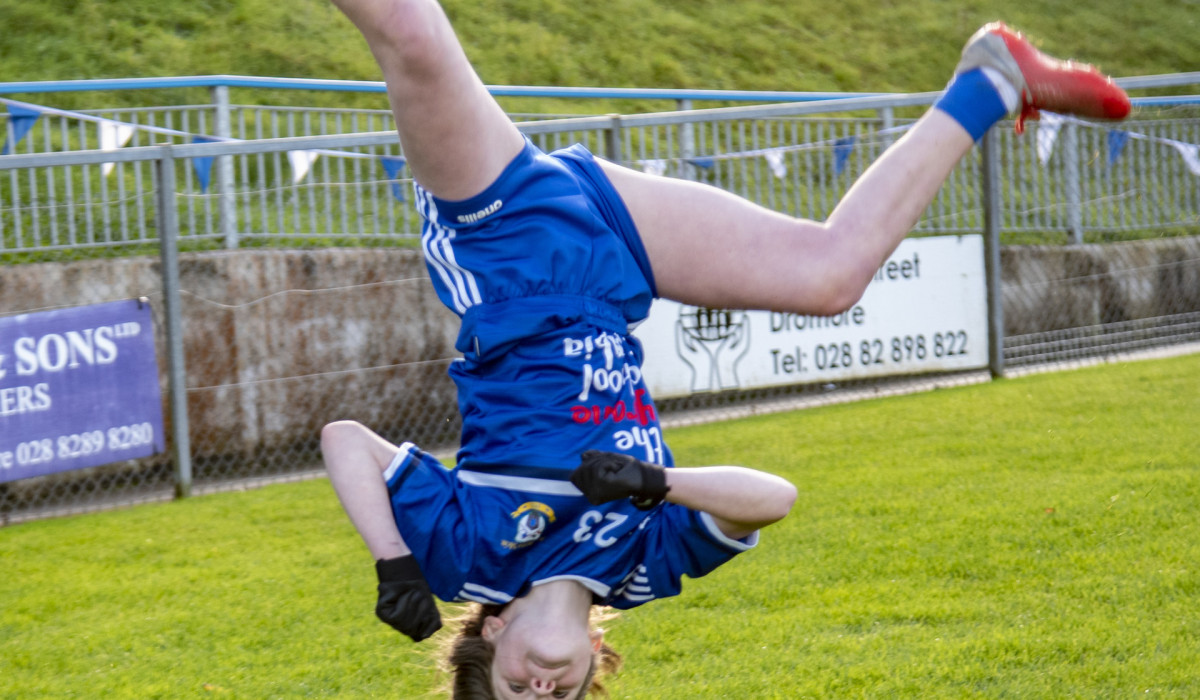 Acrobatic Tara McManus celebrates with a summersault after scoring in the U14 challenge game. JasMc10