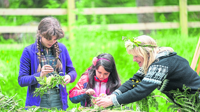 There was foraging and fun at Gortin Glens Forest Park before proceedings got underway, and local people made pretty head dresses out of ferns and flowers.